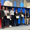 Dr Guangming Wang (middle) receiving recognition at ICRA 2026. Only five Outstanding Associate Editor Awards were presented worldwide.